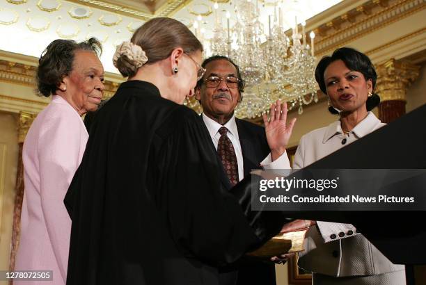 Associate Justice of the US Supreme Court Ruth Bader Ginsburg administers the oath of office to incoming US Secretary of State Condoleezza Rice...