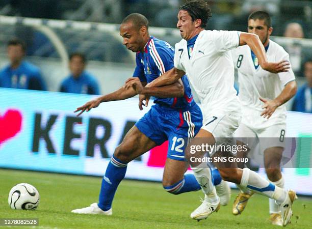 V ITALY .STADE DE FRANCE - PARIS.Franco Semioli chases down possession with French hitman Thierry Henry