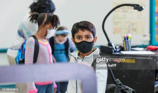 teacher, students in classroom during covid-19 pandemic - social distancing 6 feet stock pictures, royalty-free photos & images