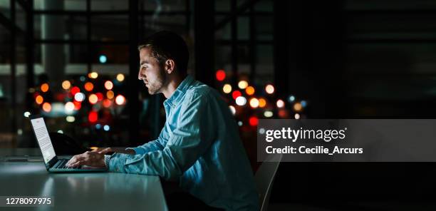 working towards success through the night - low effort stock pictures, royalty-free photos & images