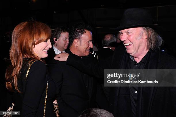 Singer Patti Scialfa singer-songwriter Bruce Springsteen and presenter Neil Young attend a dinner for the 26th annual Rock and Roll Hall of Fame...