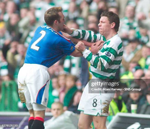 Rangers defender Fernando Ricksen and Alan Thompson get physical.