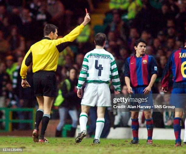 Referee Wolfgang Stark sends off Barcelona star Javier Saviola for a tackle on Alan Thompson.