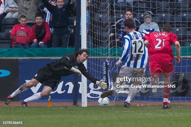 V ABERDEEN .RUGBY PARK - KILMARNOCK .Kilmarnock striker Kris Boyd stabs the ball past David Preece to make it 3-1 for the home side.