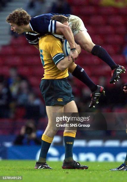 V AUSTRALIA .HAMPDEN - GLASGOW.Scotland scrum half Chris Cusiter is lifted in the air by Chris Latham.