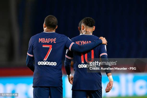 Kylian Mbappe of Paris Saint-Germain is congratulated by teammate Neymar Jr after scoring during the Ligue 1 match between Paris Saint-Germain and...