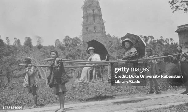 Two Western Women in Sedan Chairs, Leifeng Pagoda in the background, China, Hangzhou , Zhejiang Sheng , 1908. From the Sidney D. Gamble photographs...