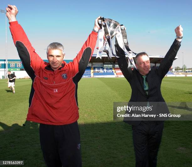 Gretna manager Rowan Alexander and assistant Davie Irons celebrate with the SFL Division One trophy