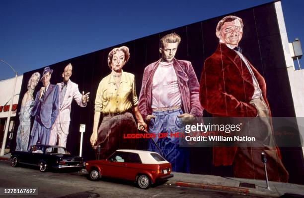 Actors and actresses Marilyn Monroe, Humphrey Bogart, Fred Astaire, Bette Davis, James Dean and Clark Gable are painted on a Hollywood wall at 1600...