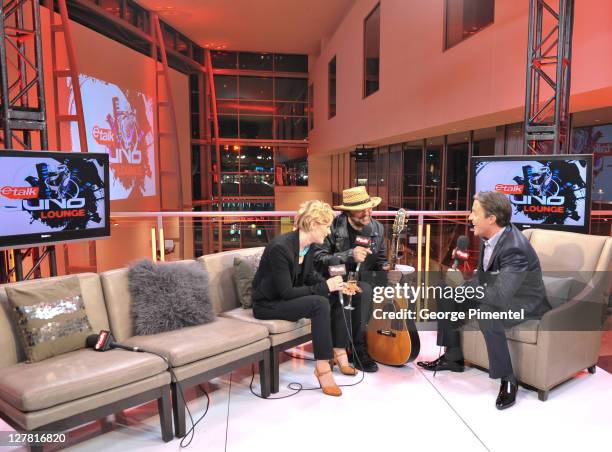 Trixie Whitley and Daniel Lanois chat with CTV's eTalk host Ben Mulroney in the eTalk Lounge featuring Beyoncé Heat during the 2011 Juno Awards at...