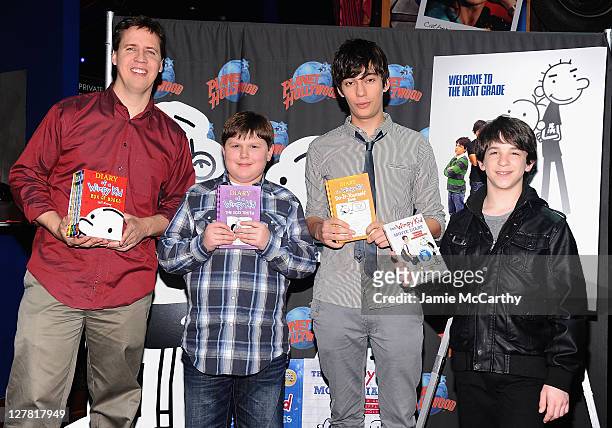 Author Jeff Kinney with actors Robert Capron,Devon Bostick and Zack Gordon visit Planet Hollywood Times Square on March 16, 2011 in New York City.