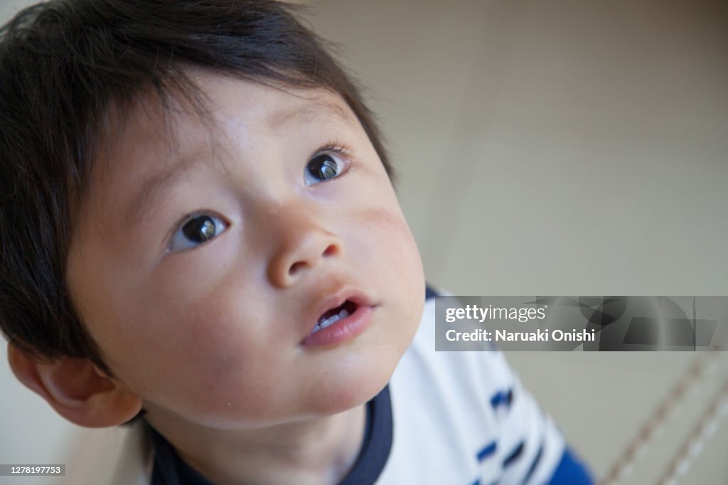 A one-year-old child with a lot of tears in his eyes