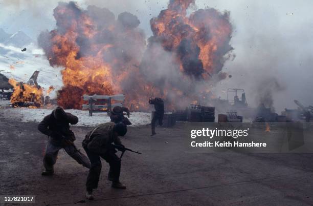 Explosions at an arms bazaar on the Russian border, in the opening sequence of the James Bond film 'Tomorrow Never Dies', 1997. This sequence was...