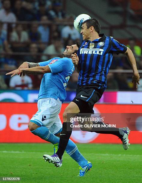 Inter Milan's Brazilian defender Lucio fights for the ball with Napoli's Uruguayan midfielder Walter Alejandro Guevara Gargano during the seria A...