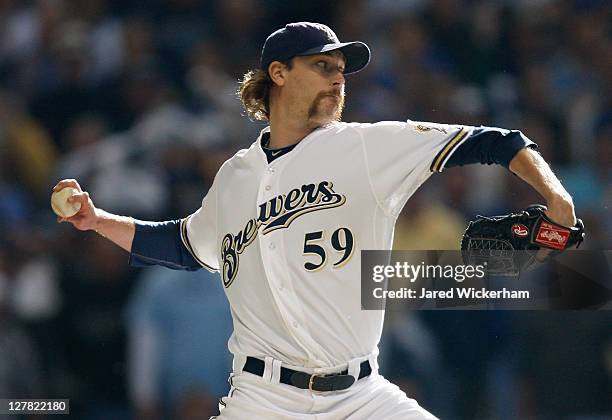 John Axford of the Milwaukee Brewers pitches against the Arizona Diamondbacks in the ninth inning during Game One of the National League Division...