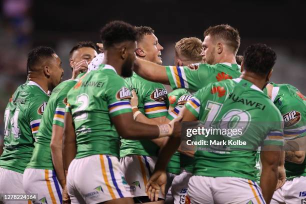 Jack Wighton of the Raiders celebrates with team mates after scoring a try during the NRL Elimination Final match between the Canberra Raiders and...