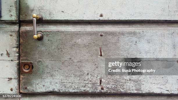 weathered rusty ancient wooden door in italy - handle stock pictures, royalty-free photos & images