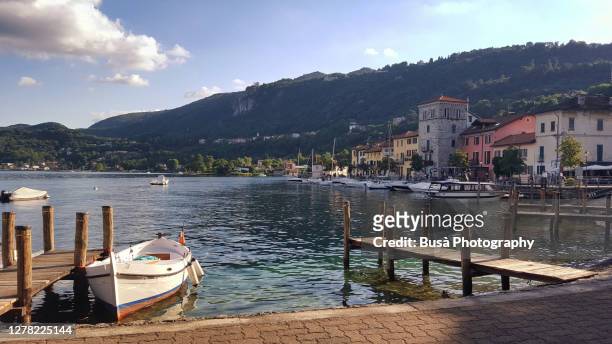 shoreline of orta san giulio in the region of piedmont, italy - lake orta stock pictures, royalty-free photos & images