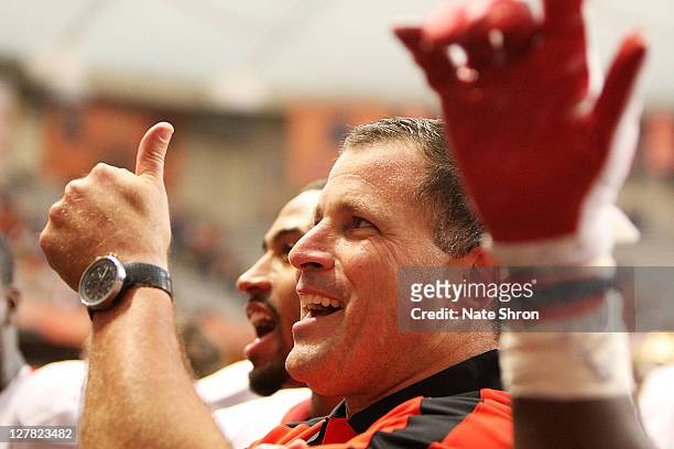 Greg Schiano, head coach of the Rutgers Scarlet Knights celebrates after an over time win against the Syracuse Orange on October 1, 2011 at the...