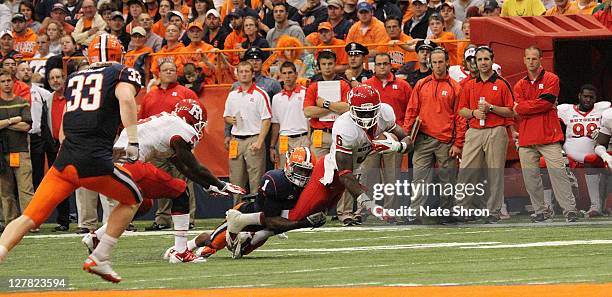 Mohamed Sanu of the Rutgers Scarlet Knights is tackled by Phillip Thomas of the Syracuse Orange during the game on October 1, 2011 at the Carrier...