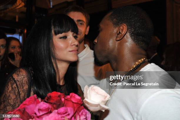 Leigh Lezark and Kanye West attend the Dw by Kanye West Ready to Wear Spring / Summer 2012 show during Paris Fashion Week at Lycee Henri IV on...