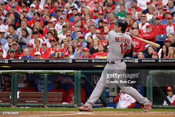 Lance Berkman of the St. Louis Cardinals hits a three-run home run in the first inning of Game One of the National League Division Series against the...