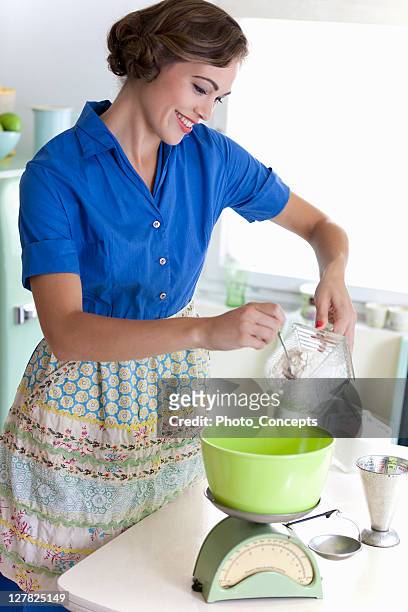 woman baking in kitchen - ideal wife stock pictures, royalty-free photos & images