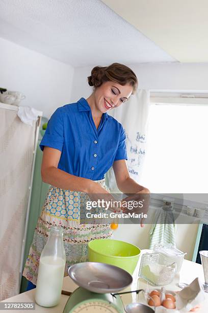 woman baking in kitchen - crack spoon stock pictures, royalty-free photos & images