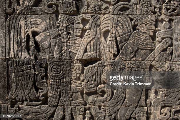 stone relief carvings at the mayan ruins of chichén itzá - mayan stock pictures, royalty-free photos & images
