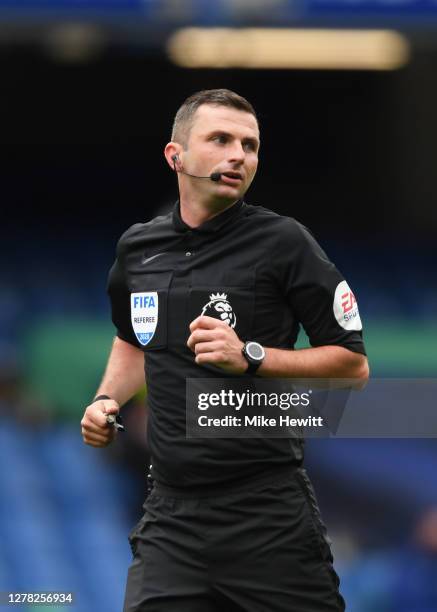 Referee Michael Oliver runs on during the Premier League match between Chelsea and Crystal Palace at Stamford Bridge on October 03, 2020 in London,...