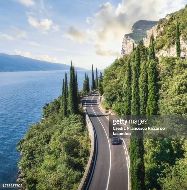 scenic road on lake garda, tremosine, lombardy, italy - road trip stock pictures, royalty-free photos & images