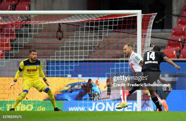 Alassane Plea of Borussia Monchengladbach scores his team's first goal during the Bundesliga match between 1. FC Koeln and Borussia Moenchengladbach...