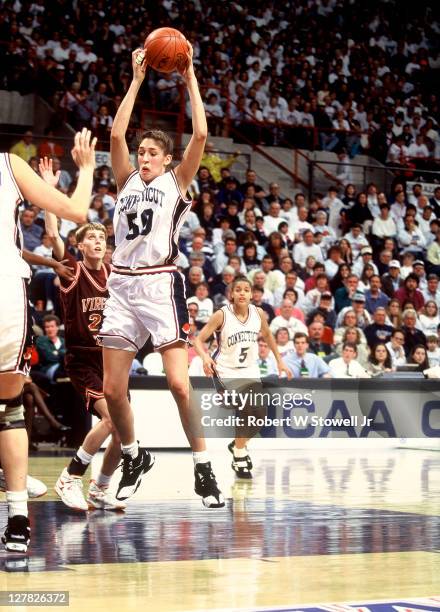 American basketball player Rebecca Lobo, of the University of Connecticut, grabs a rebound during a game against the University of Virginia, Storrs,...