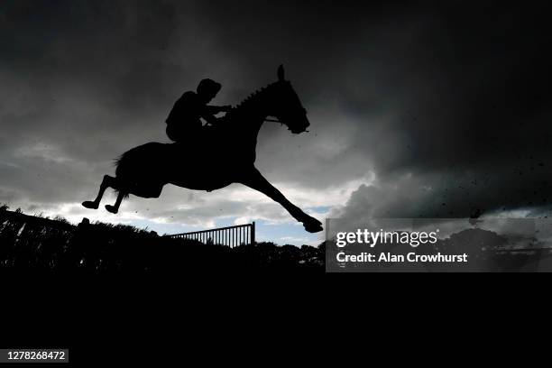 General view as runners clear a flight of hurdles in The TRM Kurasyn Handicap Hurdle at Fontwell Park Racecourse on October 03, 2020 in Fontwell,...