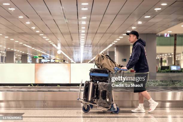 passenger  walking in the airport terminal. - singapore airport stock pictures, royalty-free photos & images