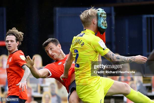 Jack Grimmer of Wycombe Wanderers is kicked in the face by Matthew Pearson of Luton Town during the Sky Bet Championship match between Luton Town and...