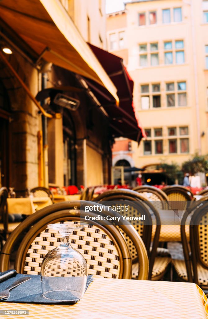 Close up of a set table outside a restaurant in Lyon