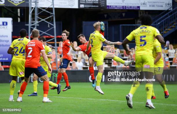 Jack Grimmer of Wycombe Wanderers is kicked in the face by Matthew Pearson of Luton Town during the Sky Bet Championship match between Luton Town and...