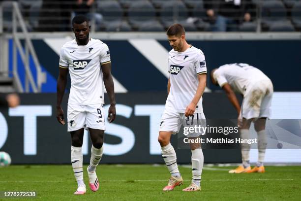 Andrej Kramaric of TSG 1899 Hoffenheim and Ihlas Bebou of TSG 1899 Hoffenheim look dejected following their team's defeat in the Bundesliga match...