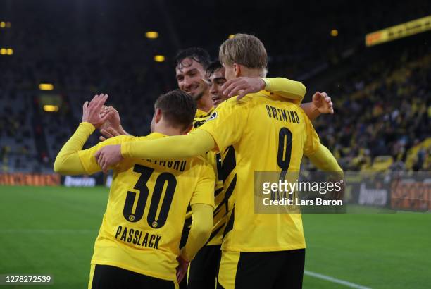 Felix Passlack of Borussia Dortmund celebrates with teammates after scoring his team's fourth goal during the Bundesliga match between Borussia...