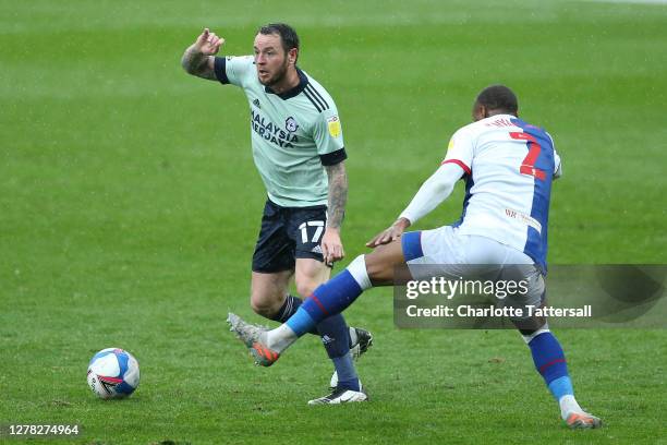 Lee Tomlin of Cardiff City on the ball with Ryan Nyambe of Blackburn Rovers during the Sky Bet Championship match between Blackburn Rovers and...