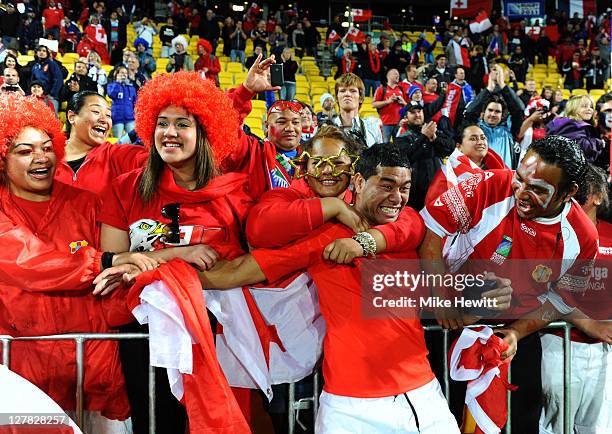 Centre Siale Piutau of Tonga celebrates with the fans following his team's 14-19 victory during the IRB 2011 Rugby World Cup Pool A match between...