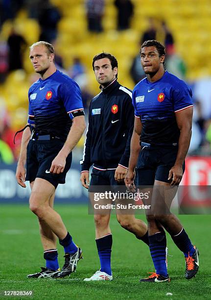 Dejected France players, Julien Bonnaire, Morgan Parra and Thierry Dusautoir look on following their team's 14-19 defeat during the IRB 2011 Rugby...