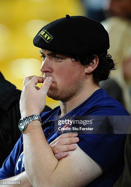 Dejected France fan looks on following his team's 14-19 defeat during the IRB 2011 Rugby World Cup Pool A match between France and Tonga at...