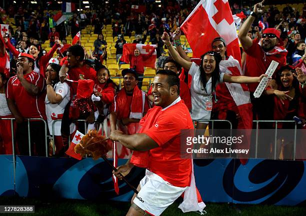 Kisi Pulu of Tonga celebrates folllowing his team's 14-19 victory during the IRB 2011 Rugby World Cup Pool A match between France and Tonga at...