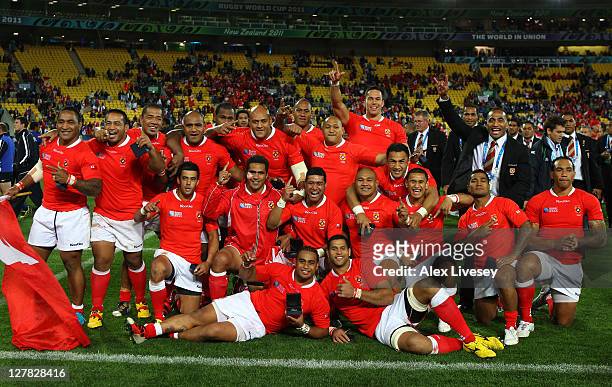Tonga players celebrate their 14-19 victory following the final whistle during the IRB 2011 Rugby World Cup Pool A match between France and Tonga at...