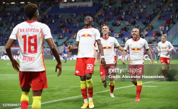 Angelino of RB Leipzig celebrates with teammates after scoring his team's second goal during the Bundesliga match between RB Leipzig and FC Schalke...