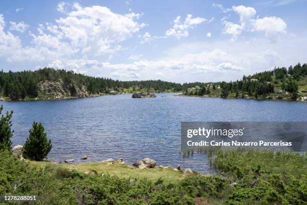 landscape of an alpine lake surrounded by hills. french pyrenees in font romeu - wilderness font stock pictures, royalty-free photos & images