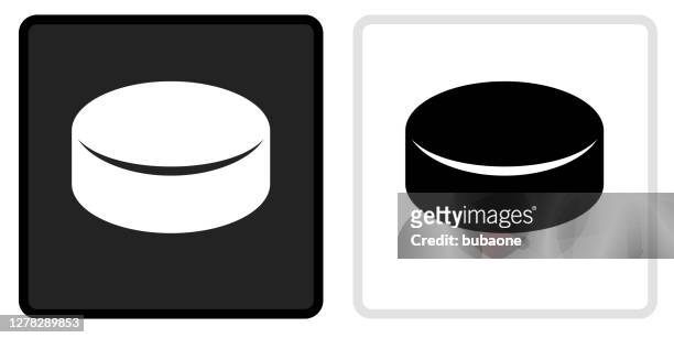 hockey puck icon on  black button with white rollover - hockey puck stock illustrations