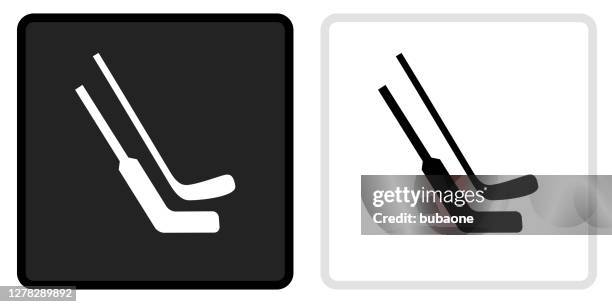 hockey sticks icon on black button with white rollover - hockey stick stock illustrations